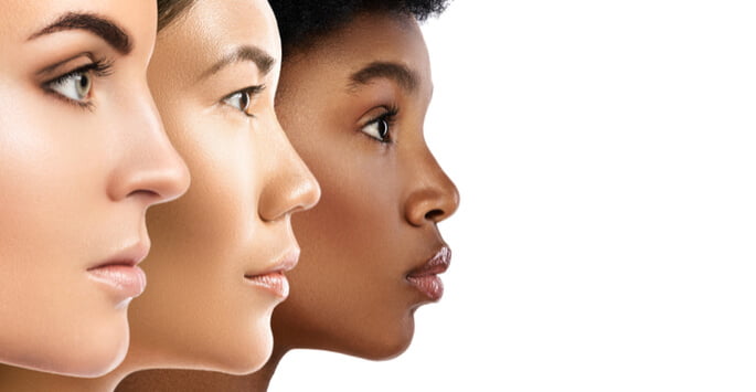 silhouette of three faces with different skin tones