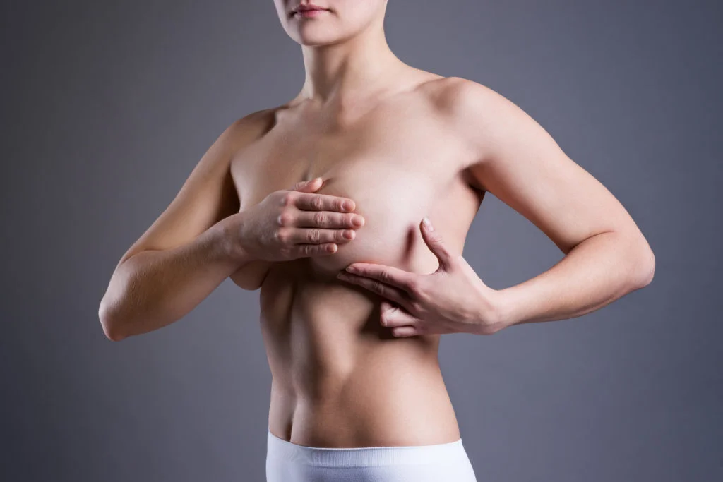 Surgeons repair woman's 'crooked breasts' following a double