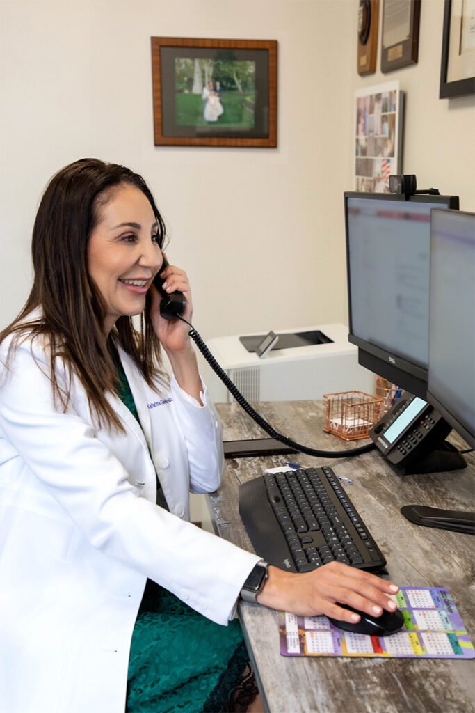 Dr. Gallus on the phone with a patient discussing their consultation