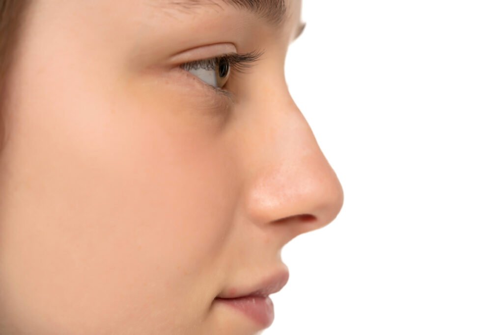 Close up of side profile of woman with slight bump in her nose bridge